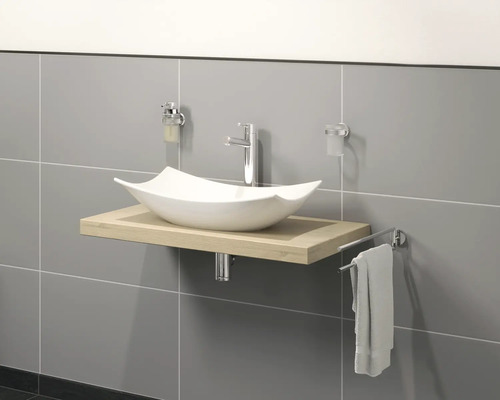 Tvättställ med tvättställsskål, armatur och handdukshållare i badrummet