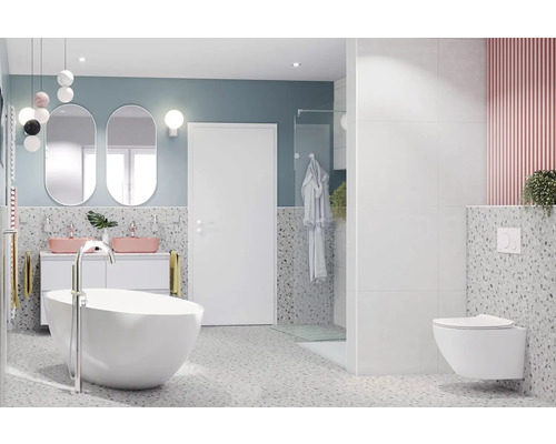 Modernt badrum med fristående badkar, tvättställsskåp med två tvättställ och vägghängd toalett