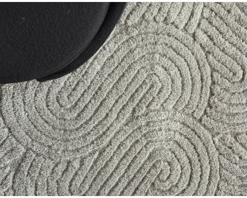 Detaljvy av en matta med grafiskt mönster