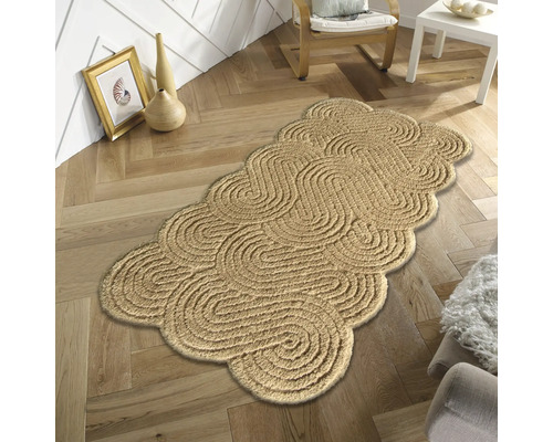 Dekorativ matta med slingrande design på trägolv