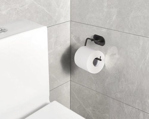 Toalettpappershållare med toalettpapper på en badrumsvägg