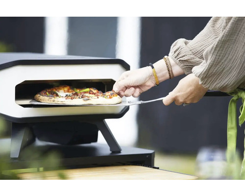 Pizzaugn med pizza och pizzaspade