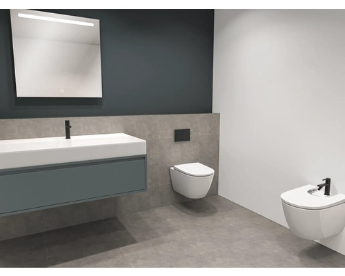 Modernt badrum med tvättställ, belyst spegel, vägghängd toalett och bidé.