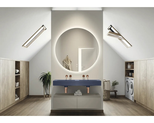 Modernt badrum med takfönster, rund spegel och dubbla handfat