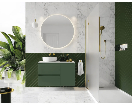 Modernt badrum med grön kommod, rund spegel och dusch