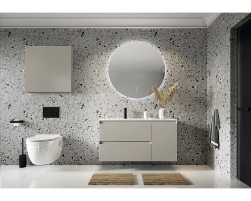 Modernt badrum med tvättställ, spegelskåp, rund spegel med belysning och hängande toalett