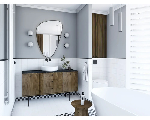 Modernt badrum med tvättställsskåp, spegel och fristående badkar