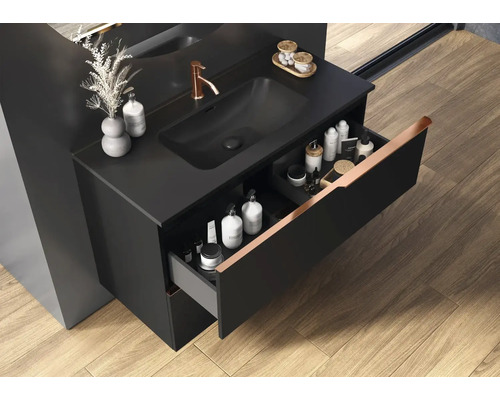 Tvättställsskåp med öppen låda i badrum