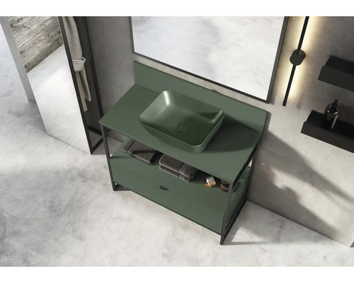 Badrum med underskåp för tvättställ och tvättställsskål i ett ljust rum.