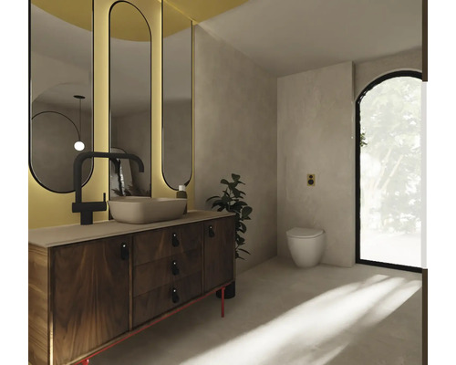 Badrum med handfat, spegel och toalett för en ljus och vänlig atmosfär