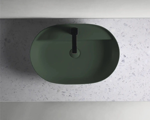 Tvättställ av keramik med blandare uppifrån