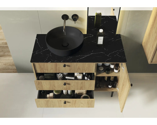 Badrumsskåp med svart tvättställsskål, lådor och skåpdörr