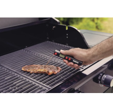 Tenneker logotyp. En biff ligger på en grill vars temperatur mäts med en grilltermometer.