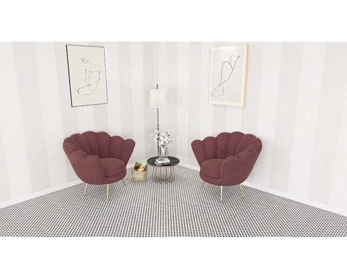 Hörnrum med två snäckformade stolar, sidobord, golvlampa och konstverk på väggen