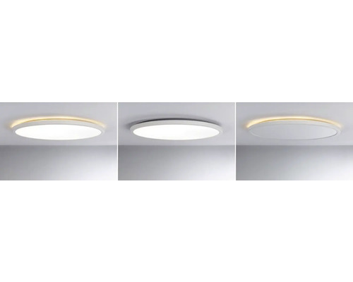 Tre runda taklampor med olika belysning i ett tak