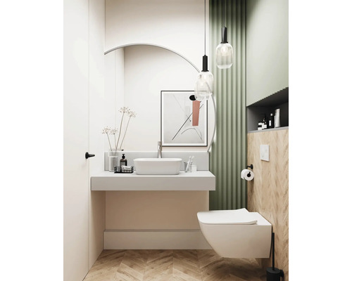 Ljust badrum med handfat, toalett och dekorativa element