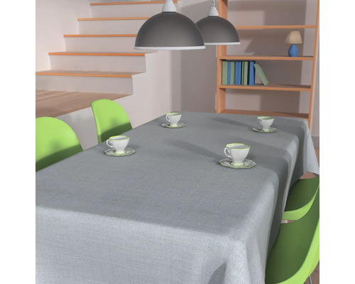 Matbord med grå duk och ställd servis