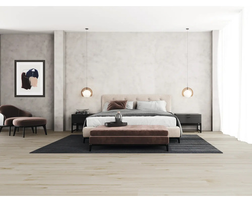 Sovrum med säng, nattduksbord, matta och dekorationer