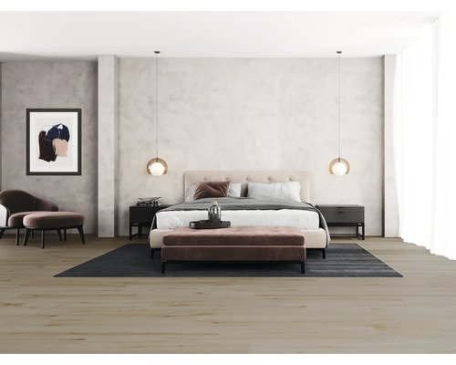 Sovrum med dubbelsäng, sängbord, matta och sittmöbler