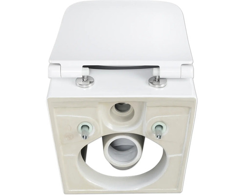 Detaljerad vy underifrån av en vit toalett med toalettlock