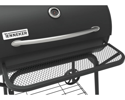 Detaljvy av Tenneker kolgrill med förvaringsutrymme och temperaturdisplay