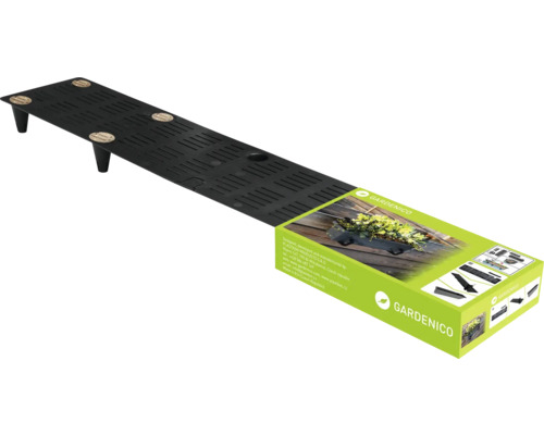 Svart blomlådsställ med produktförpackning