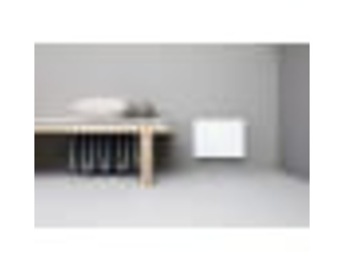 Miljö med värmeelement för väggmontering bredvid bord