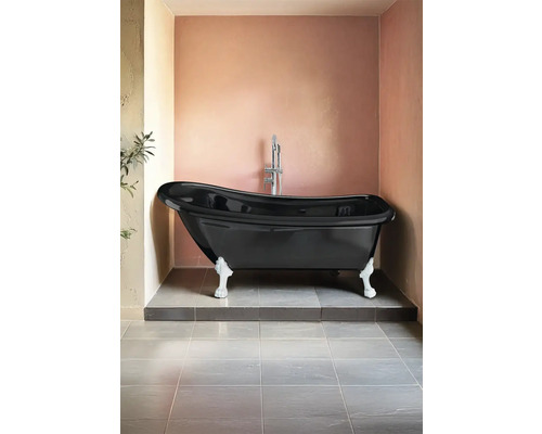 Fristående badkar i svart med fötter i badrummet