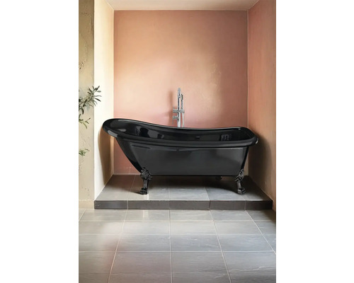 Fristående svart badkar i badrummet
