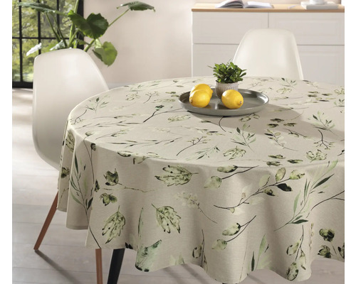 Runt bord med duk med växtmönster