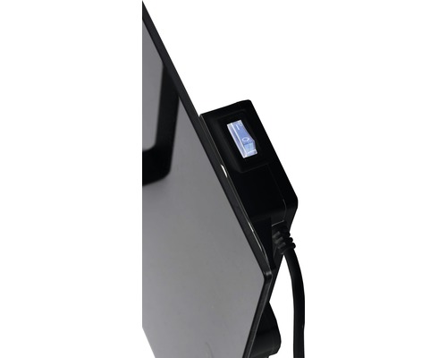 Detaljvy av ett värmeelement med strömbrytare