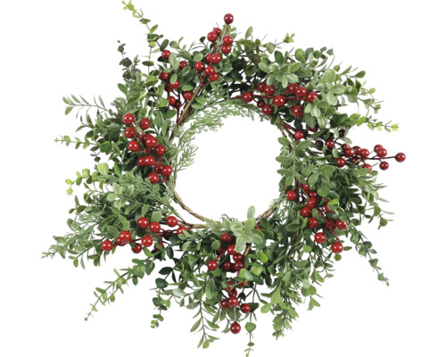 Dekorativ krans med gröna blad och röda bär