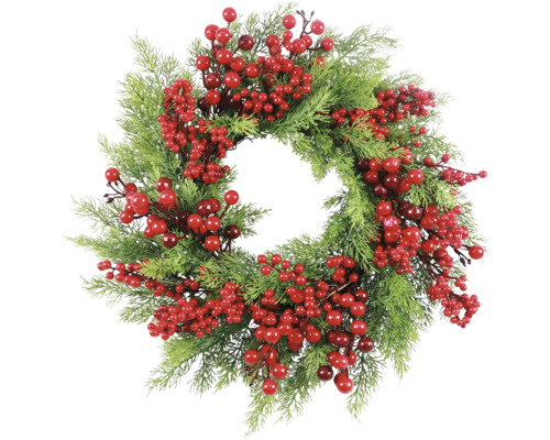 Dekorativ krans med bär och grangrenar som festlig dekoration