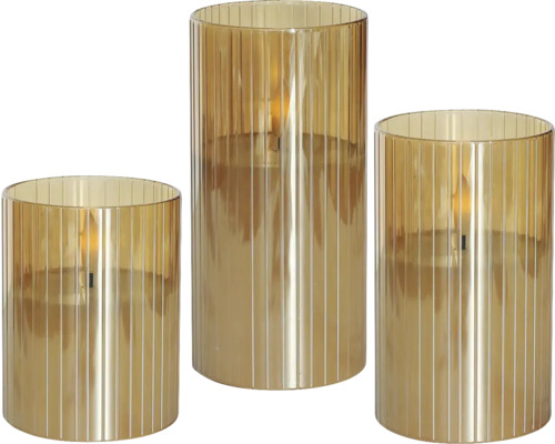 Tre ribbade cylindriska glas med LED-ljus