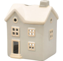 Dekorativt värmeljus i form av ett hus med fönster och skorsten