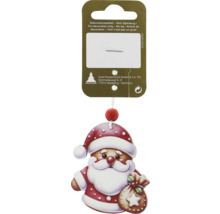 Julgransdekoration med jultomte på förpackning
