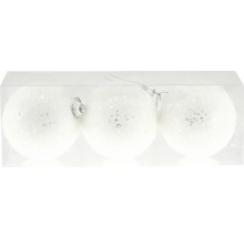 Tre vita julgranskulor med glitter i en transparent förpackning.