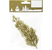 Dekorativ gren av plast i förpackning