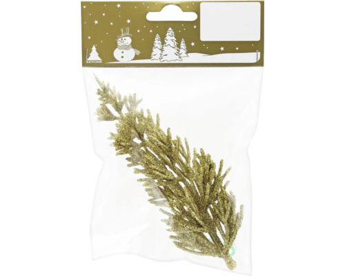 Dekorativ gren av plast i förpackning