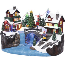 Juldekoration med hus, bro, vattenfall, träd och figurer