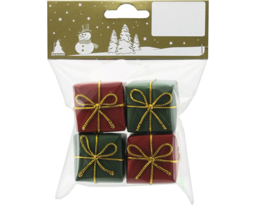 Förpackning med fyra små presentaskar i rött och grönt med gyllene band som juldekoration