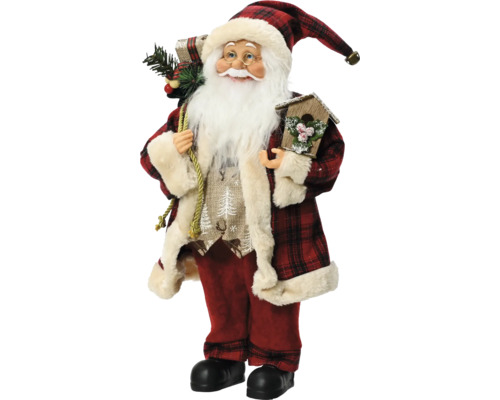 Dekorativ jultomte med rutig kappa och hatt, som håller ett fågelholk och bär en säck med grangrenar.