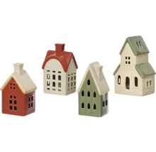 Fyra dekorativa hus gjorda av keramik med fönsteröppningar