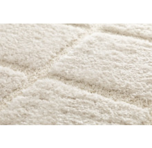 Detaljvy av en matta med ett geometriskt mönster