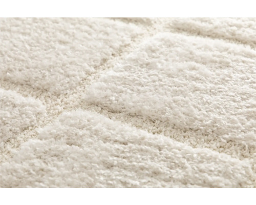 Detaljvy av en matta med ett geometriskt mönster