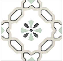 Dekorativ platta med geometriskt och blommönster