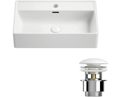 Vy från ovan på ett tvättställ med avloppsarmatur