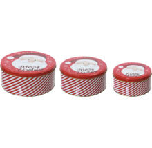 Tre runda förvaringsburkar med julmotiv och randigt mönster