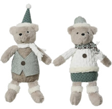 Två teddybjörnar som dekorativa gosedjur med vinterkläder