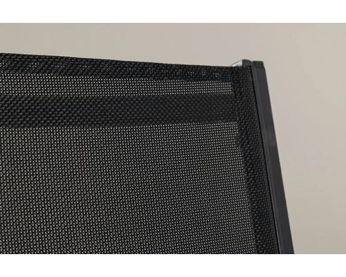 Detaljvy av en svart textilväv